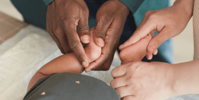 parents massage infants' feet