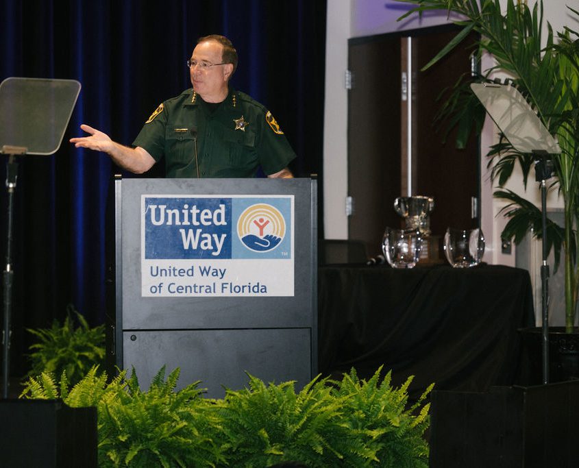 Sheriff Grady Judd speaks at a podium